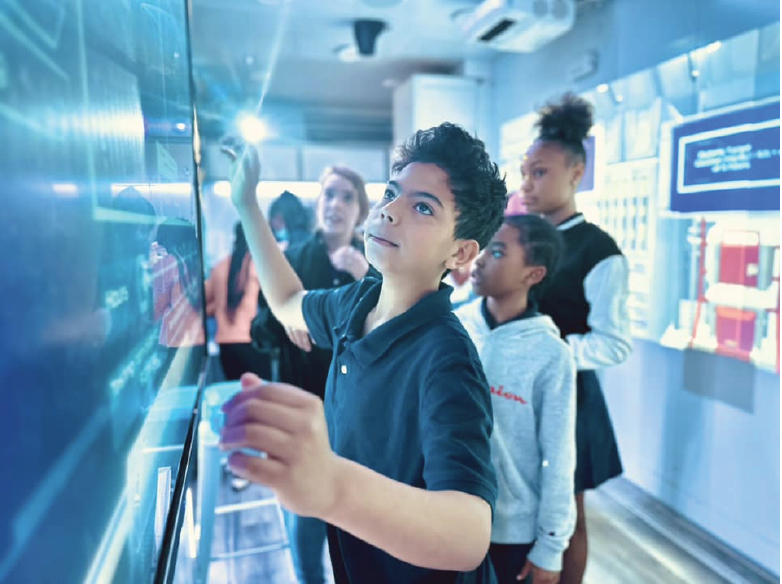 Close up of student using an interactive wall
