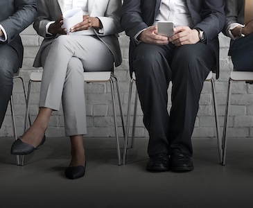 Close up of employees sitting and waiting for interview