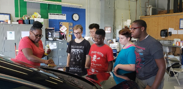 Autoworks students detailing a car