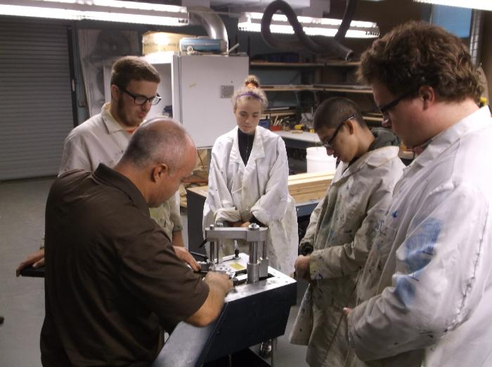 Students in FRAMEworks using equipment
