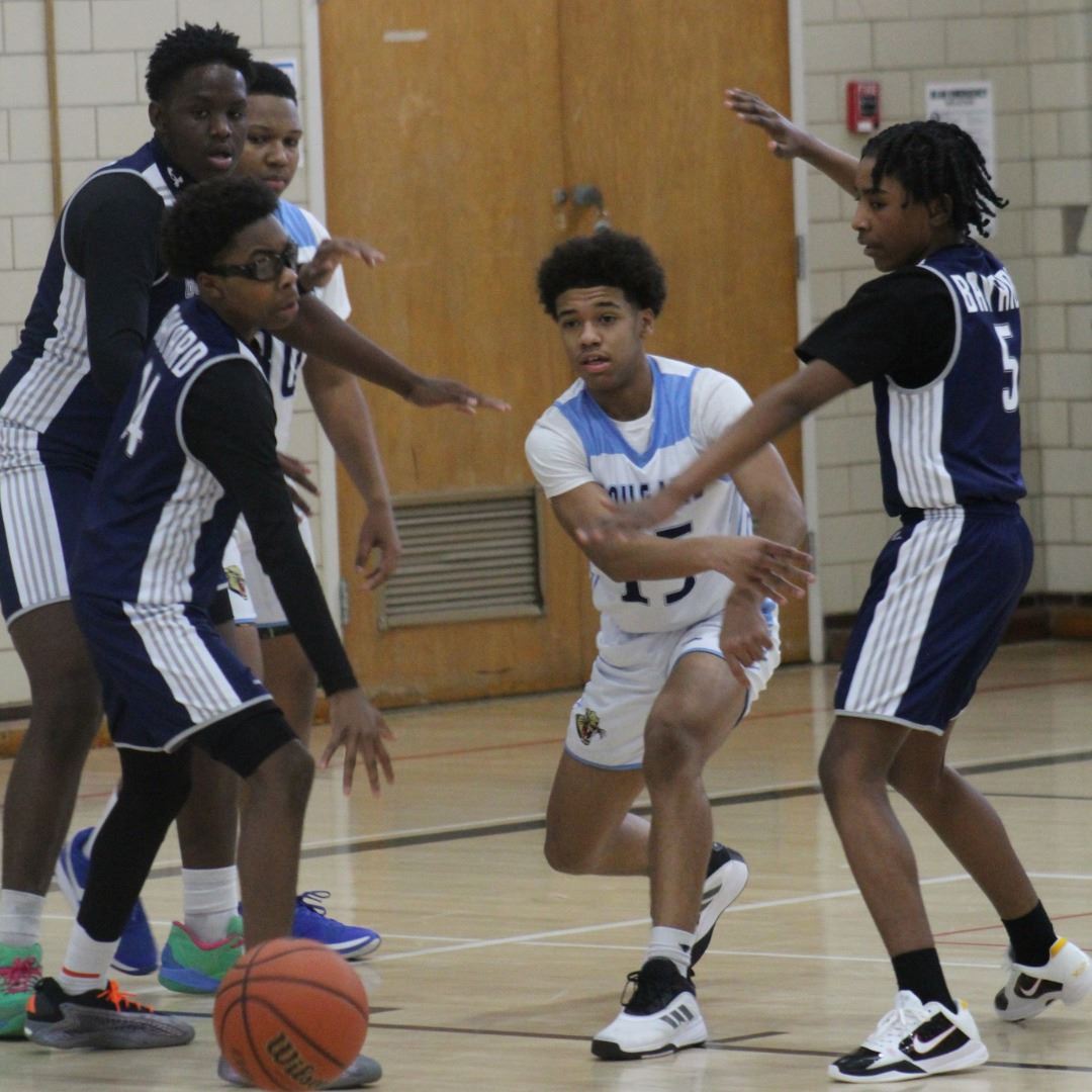  Photo of middle school boys playing basketball