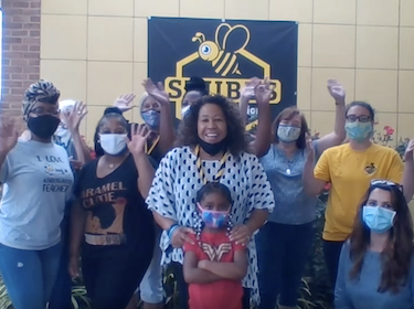  photo of stubbs school leader, staff and student