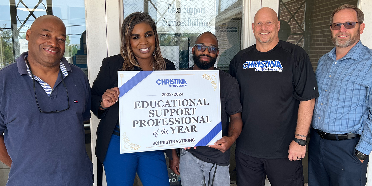 Group photo featuring Christina School District Educational Support Professional of the Year, Khiry Henderson