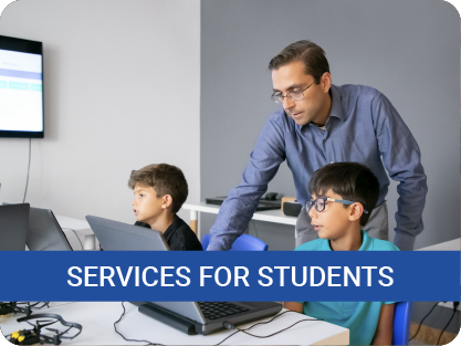 "Services for students" - image of teacher helping student use computer